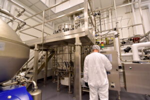 Cytovance microbial CDMO expert working in 1000L fermenter.