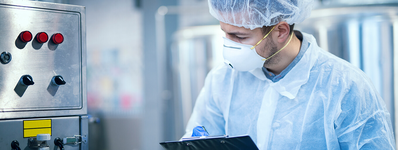 Scientist in Lab with Equipment providing Regulatory Support